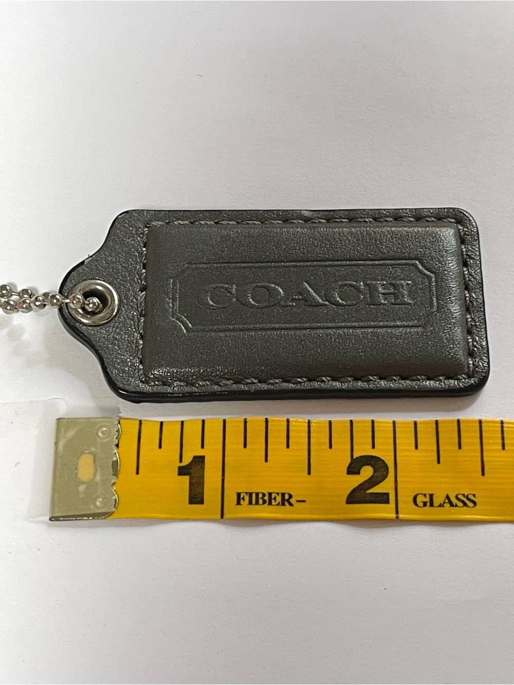 COACH Dark Gray Metallic Leather Hang Tag